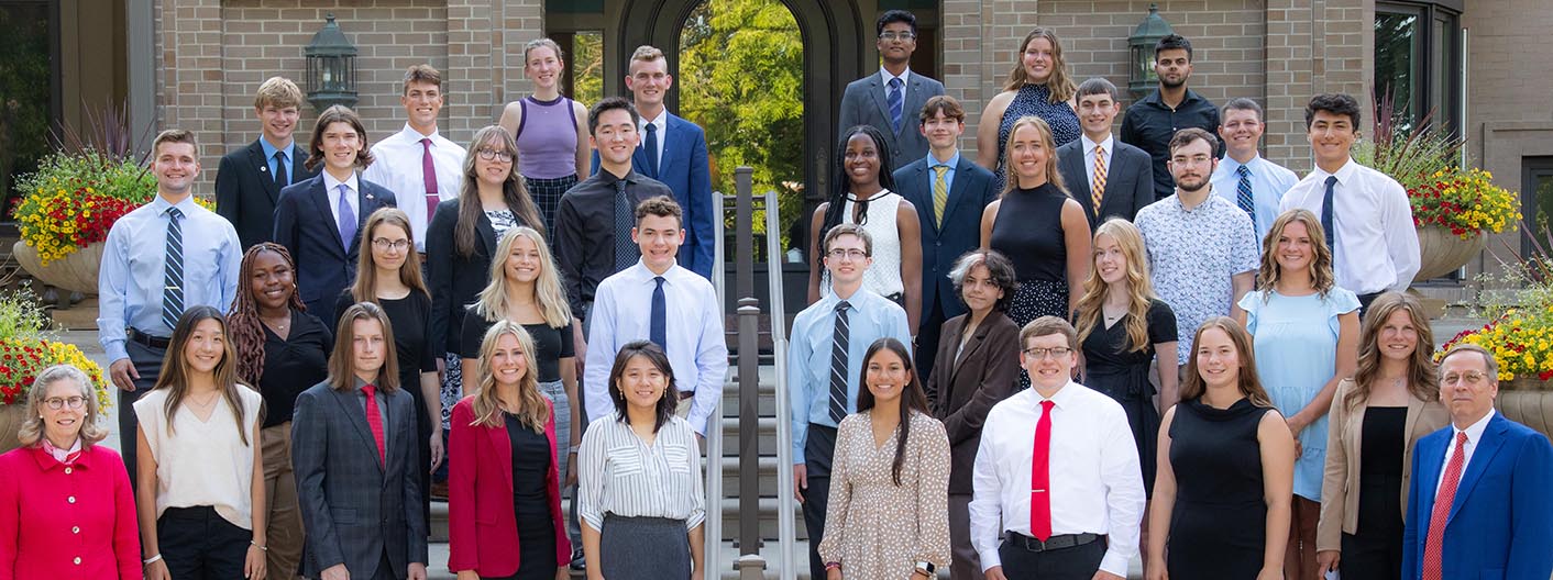 Group shot of the 2022 President's Leadership Class taken on the steps of The Knoll