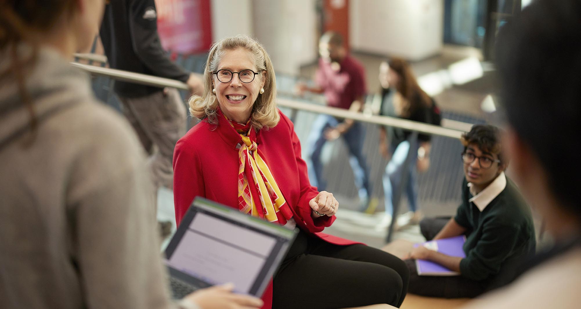 ISU President Wendy Wintersteen talks with students in the Student Innovation Center.